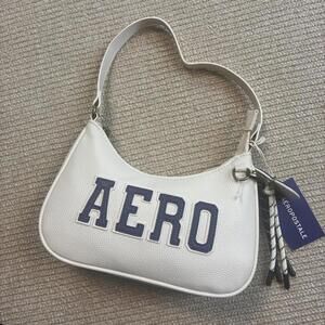 Aeropostale white faux leather hand bag hobo heart charm and tassles new w tags